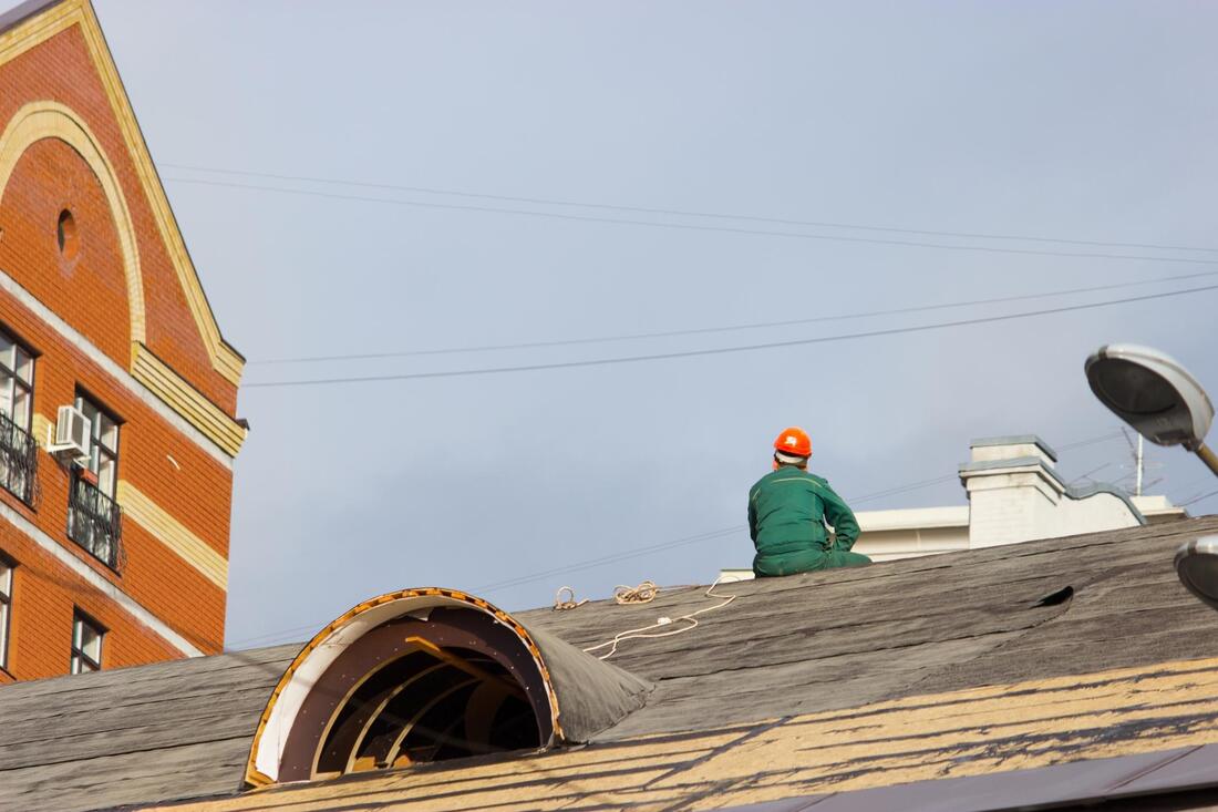 man installing a new roof